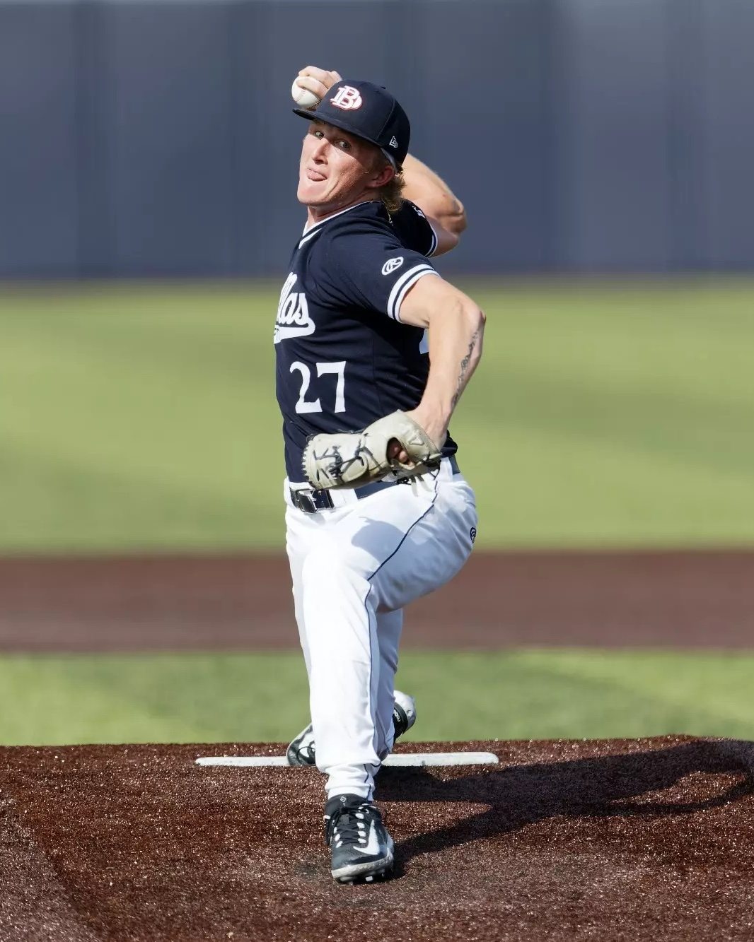 Kobe Minchey mid-delivery on the mound in a Dallas Baptist uniform